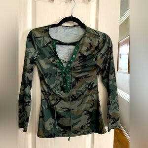 Two camo shirts. I think XS hood used condition. As is. Long sleeve lace up V